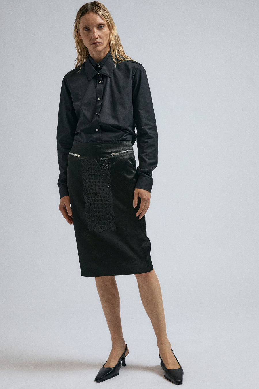 Woman wears JordanLuca FW24 black Joker Shirt, paired with Black Bumpster Skirt